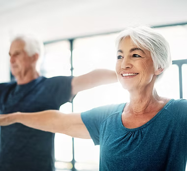 Older adults stretching in a gentle exercise class